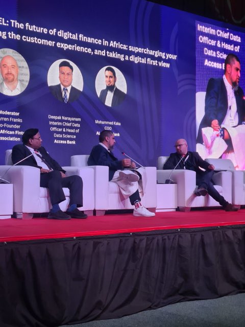 TITC on stage at a FinTech speaking engagement.